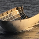 Half of the SpaceX fairing—and it’s surprisingly intact despite missing the recovery net. (Image: SpaceX)